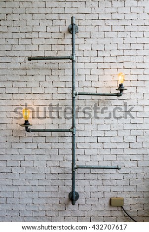 Home decoration pipes light bulb with white wall