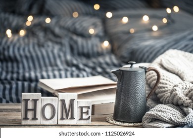 home decorations in the interior of a letter with an inscription home on a wooden background in the interior of the bedroom