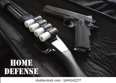 Home Defense Concept With 12 Gauge Shotgun With 45 Auto 1911 Handgun  