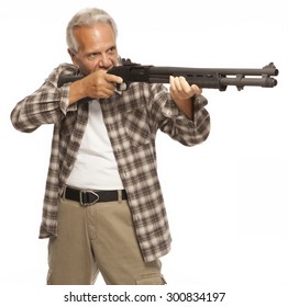 HOME DEFENSE | Shotgun In The Hands Of A Mature Male Adult, Ready To Fire. Gun Owner Protecting His Home Or Loved Ones With A Firearm.