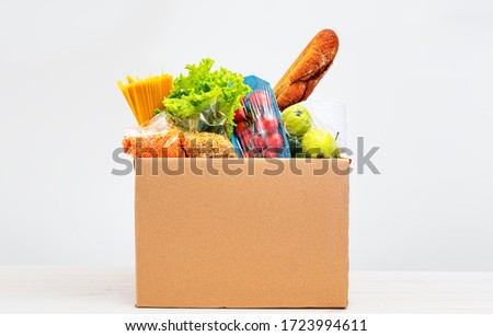 Home delivery food. Set of products and essentials in a cardboard box. donation during an epidemic. Copy spase [[stock_photo]] © 