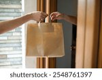 Home delivery handling to customer, Paper bag, Takeaway food order fulfillment