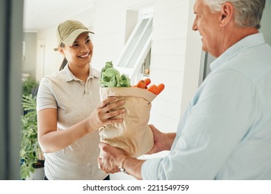 Home delivery service, fresh vegetables and customer paper bag logistics of healthy groceries at front door house. Happy woman courier giving organic grocery shopping package to senior consumer man - Powered by Shutterstock