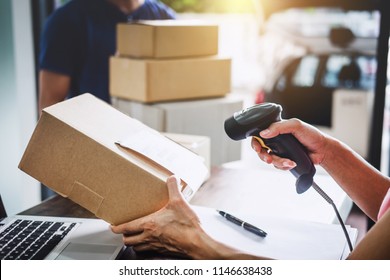 Home delivery service and working service mind, Woman working barcode scan to confirm sending customer in post office. - Shutterstock ID 1146638438