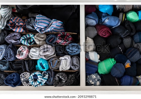 Home drawer box with\
organized folded underwear lingerie KonMari marie kondo vertical\
storage method. Sorted many different undergarments pants and socks\
at bedroom dresser
