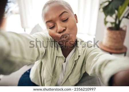 Home, face or black woman taking a selfie with a kiss or pout on sofa to post on social media. Apartment, house or African person taking a photo, vlog or picture on couch in living room to relax