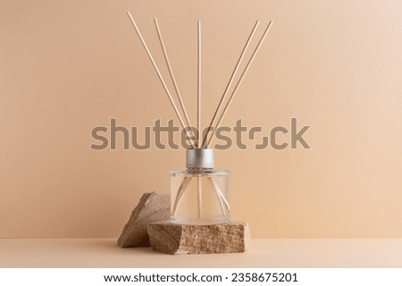 Home fragrance diffuser with reed sticks on stone podium for mock-up