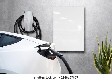 Home garage charging electric vehicle with cable Tesla