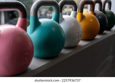 At home gym including kettlebell weights, person getting fit and strong - Shutterstock ID 2257936737