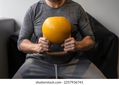 At home gym including kettlebell weights, person getting fit and strong - Shutterstock ID 2257936741