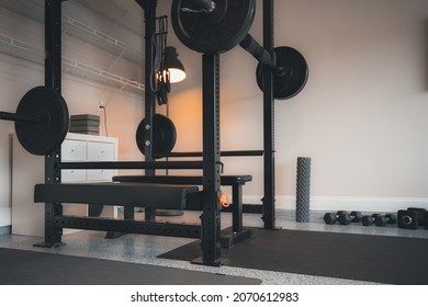 Home Gym With Weight Rack, Bench, Dumbbells, Resistance Bands Around The Garage.  