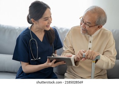 Home health care nurse caregiver take care senior elderly man at home she showing the health care madicine program and explain the previous report to retirement oldman 
						
						