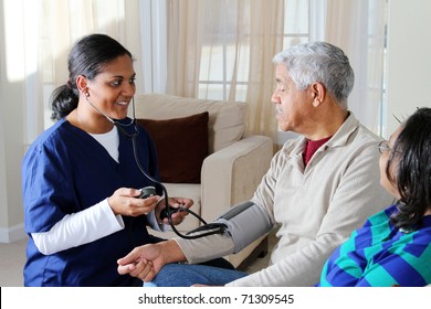 Home Health Care Worker And An Elderly Couple