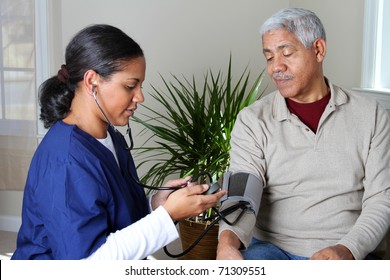 Home Health Care Worker And An Elderly Couple