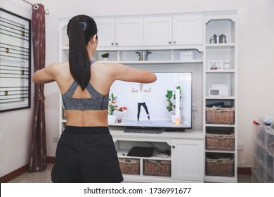 Home Healthy Exercise Concept, Asian Fit Woman Stay Home And Training Online Sport Workout Class On Tv At Home, New Normal Life Of Covid-19 Outbreak