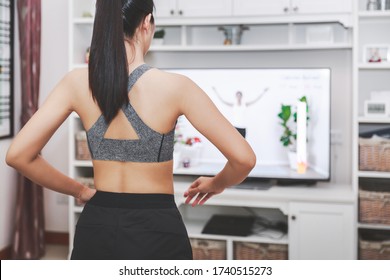 Home Healthy Exercise Concept, Asian Fit Woman Stay Home And Training Online Sport Workout Class On Tv At Home, New Normal Life Of Covid-19 Outbreak