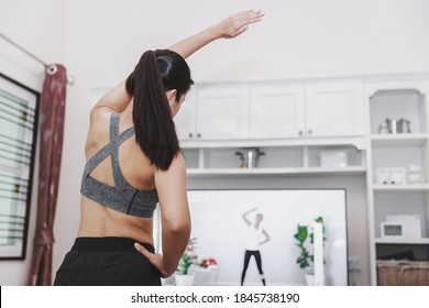 Home Healthy Exercise Concept, Asian Fit Woman Stay Home And Training Online Sport Workout Class On Tv At Home, New Normal Life Of Covid-19 Outbreak