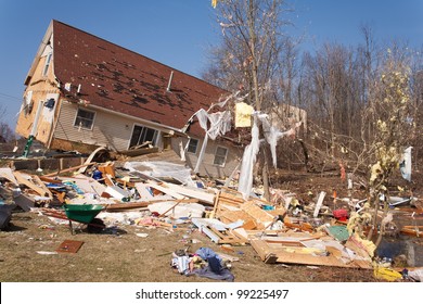 A home heavily damaged by an F2 tornado that swept through Oregon Twp in Lapeer County, MI on March 15, 2012. The house was lifted from its foundation. This photo was taken the next day.