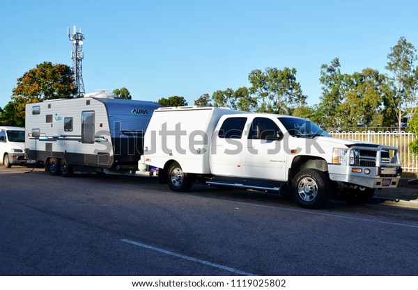 Home Hill, Queensland,\
Australia, June 23rd 2018, Large American vehicle towing caravan\
parked at rest stop