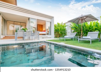 Home Or House Exterior Design Showing Tropical Pool Villa With Greenery Garden, Sun Bed, Umbrella, Pool Towels