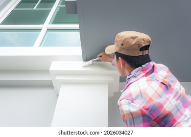 Home Or House Painting Work Consist Of Painter Man Or Worker Person And Bristles Brush. That Service To Renovation, Construction, Improvement Or Repair At Crown Molding Or Cornice At Top Column.
