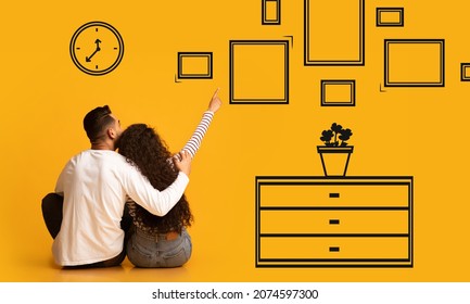 Home Improvement Concept  Back Rear View Of Millennial Couple Thinking About Flat Renovation  Young Spouses Sitting On Floor Near Orange Yellow Wall And Pointing At Drawn Paintings  Creative Collage