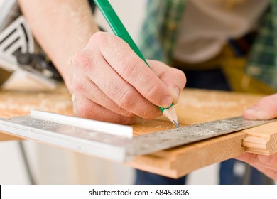 Home Improvement - Handyman Prepare Wooden Floor In Workshop