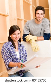 Home Improvement Happy Young Couple With Architectural Blueprints