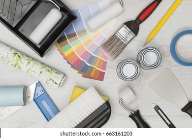 Home improvement painting tools and on a white wooden surface overhead shot - Powered by Shutterstock