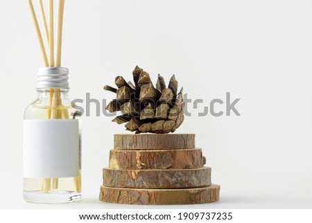 Home incense sticks with natural pine scent. Cones and spruce frame with aroma diffuser. Eco-friendly home fragrance concept