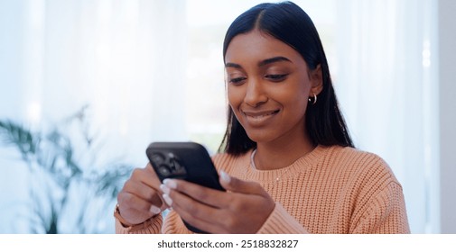 Home, Indian woman and connection with smartphone for chat, message and communication with contact. House, female person or phone with mobile app for scroll, share reel and online dating with smile - Powered by Shutterstock - Get 15% off with code: PIKWIZARD15