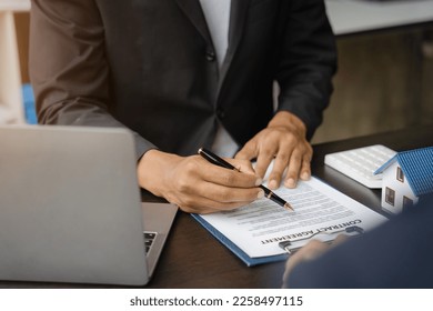 Home Insurance and Real estate investment concept,  new client after signing agreement contract with approved property application form. - Shutterstock ID 2258497115