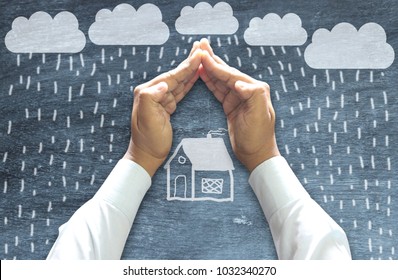 Home Insurance & Security Concept : Human hands protecting house