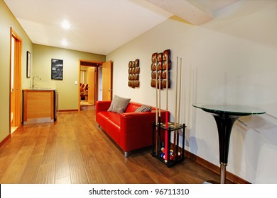 Home Interior Basement Play Room Hall Way Area With Red Sofa.