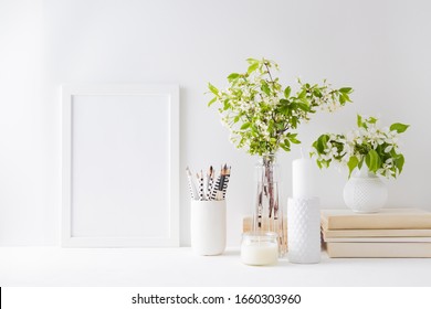 Home Interior With Decor Elements. Mockup With A White Frame, Spring Flowers In A Vase On A Light Background