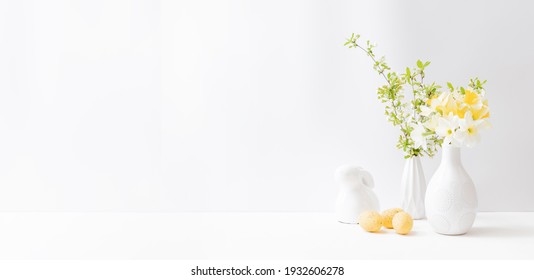 Home Interior With Easter Decor. Daffodils In A Vase, Spring Flowers On A Light Background