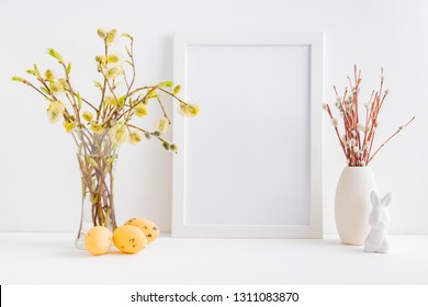 Home Interior With Easter Decor. Mockup With A White Frame And Willow Branches In A Vase On A Light Background