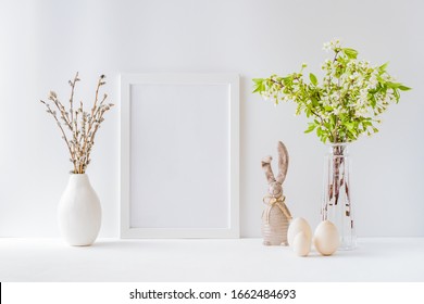 Home Interior With Easter Decor. Mockup With A White Frame And Spring Flowers In A Vases On A Light Background