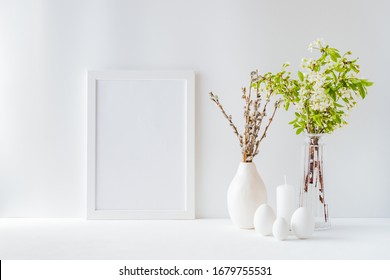 Home Interior With Easter Decor. Mockup With A White Frame And Spring Flowers In A Vases On A Light Background