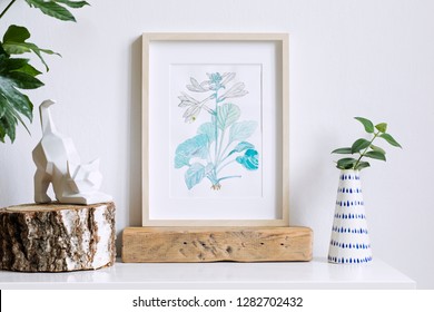 Home interior floral poster mock up with vertical wooden photo frame, design vase with flower, cat figure on white wall background. Concept of white shelf.