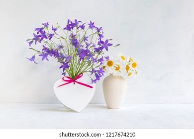 Home Interior And Garden Concept With Summer Flowers In A Vase On A Light Background