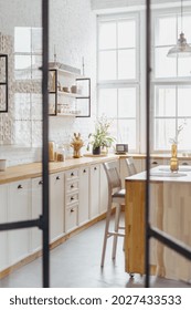 Home Interior, Modern Kitchen Design With Wooden Furniture. Open Door To White Room, Scandinavian Apartment With Wood Decor. Contemporary Room With Cabinet, Drawer, With Kitchenware.