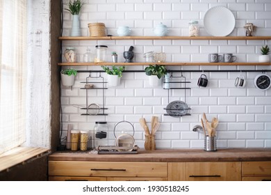 Home interior of a trendy, stylish, bright Scandinavian-style kitchen with open shelves. Loft interior.