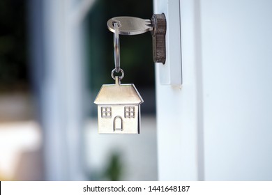 Home Key For Unlocking The New House Door. Renting, Buying, Selling Houses 