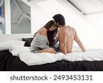 Home, kiss and couple in bed with intimacy, romance and bonding together in marriage with love. Happy people, woman and man with affection, embrace and passionate in relationship with commitment