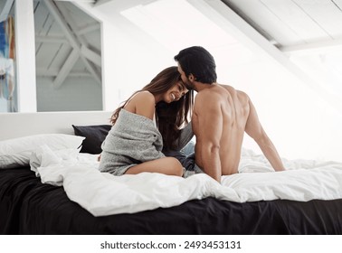 Home, kiss and couple in bed with intimacy, romance and bonding together in marriage with love. Happy people, woman and man with affection, embrace and passionate in relationship with commitment - Powered by Shutterstock