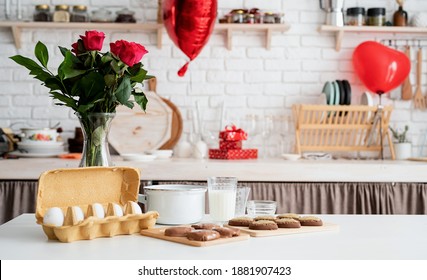 Home Kitchen With Baking Ingredients On The Table And Valentines Day Festive Decorations