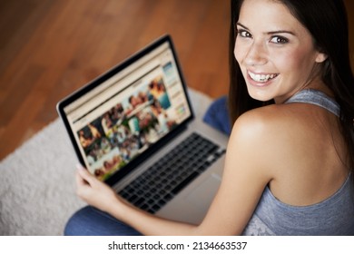 At Home And At Leisure. Portrait Of A Young Woman Working On A Laptop At Home.