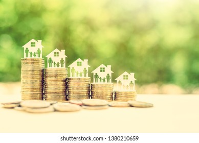 Home Loan, Cost Of Living, Financial Concept : Family Members In A House On Rows Of Rising Coins, Depicts Amount Of Money Needed To Pay / Sustain Certain Standard Of Living By Affording Basic Expenses