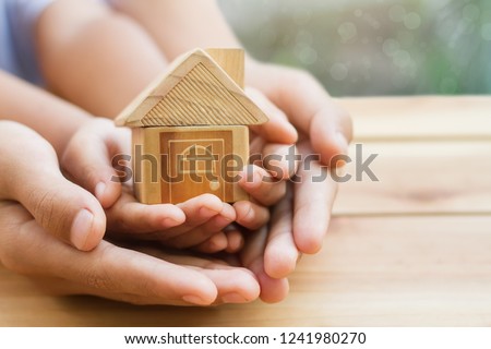 Home loan, home insurance, family life assurance protection, financial mortgage for house building, and legacy planning investment concept with children - parent's hands holding private property